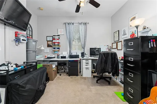 a kitchen with refrigerator and window