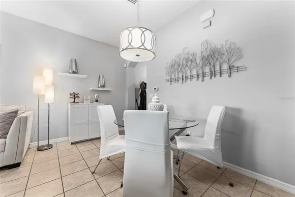 a view of kitchen and dining area with chandelier