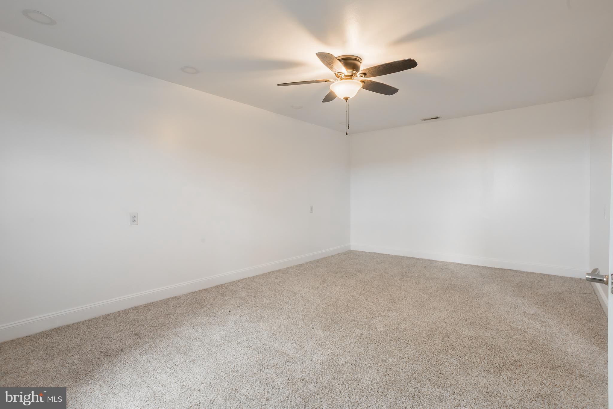 8952 Cannon Road Bridgeville, DE 19933 - Photo 17 of 29 an empty room with chandelier fan