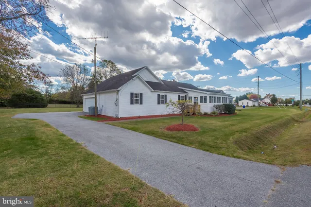 a view of house with backyard and entertaining space