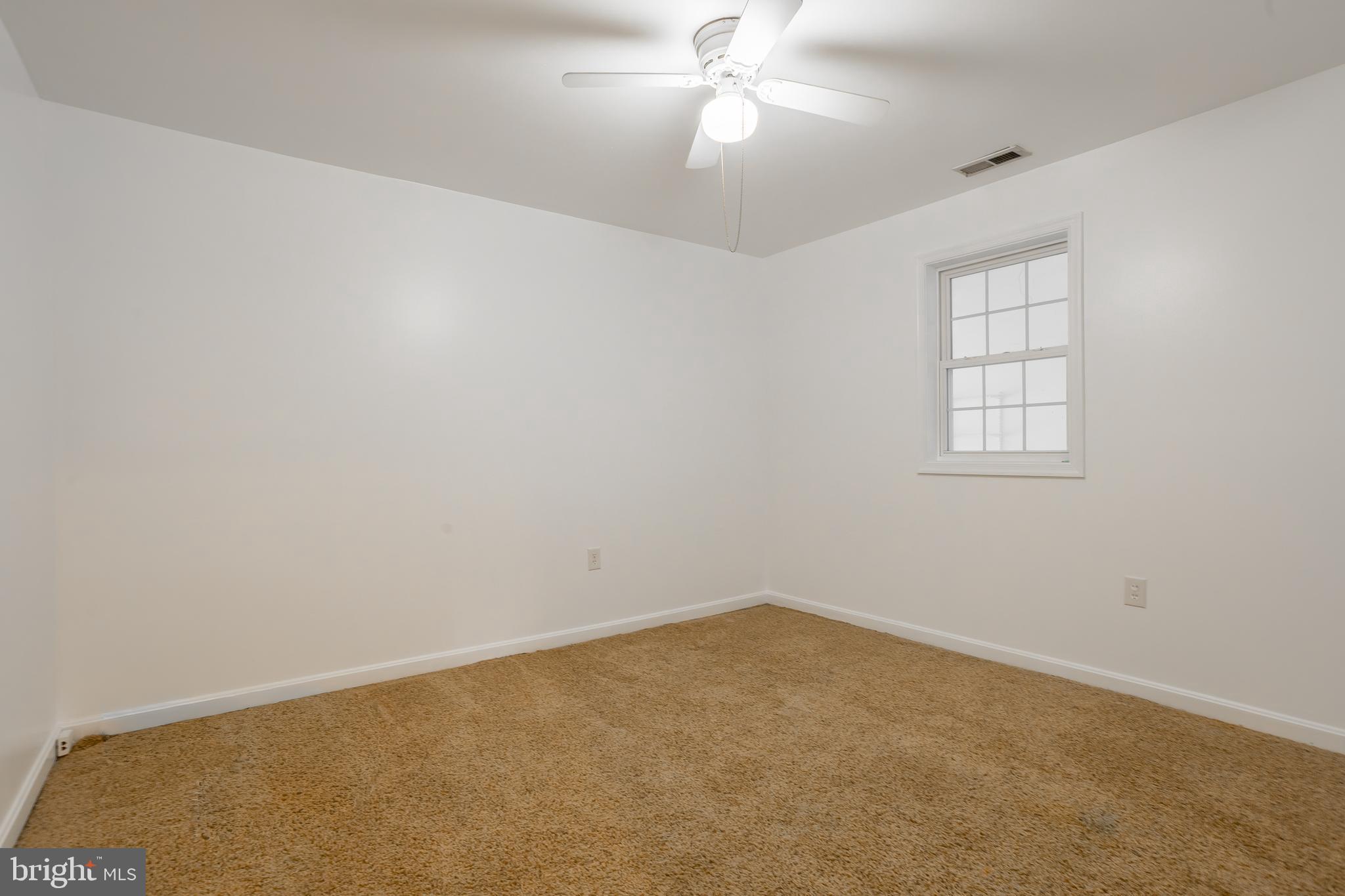 8952 Cannon Road Bridgeville, DE 19933 - Photo 21 of 29 an empty room with windows and fan