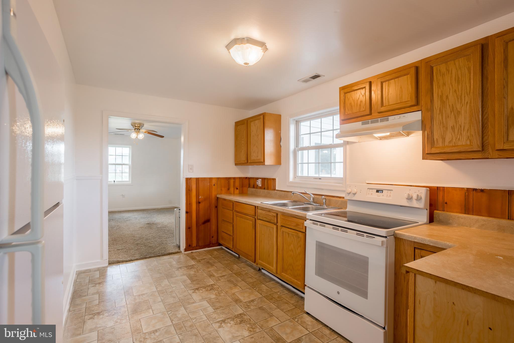 8952 Cannon Road Bridgeville, DE 19933 - Photo 10 of 29 a kitchen that has a sink and a stove in it
