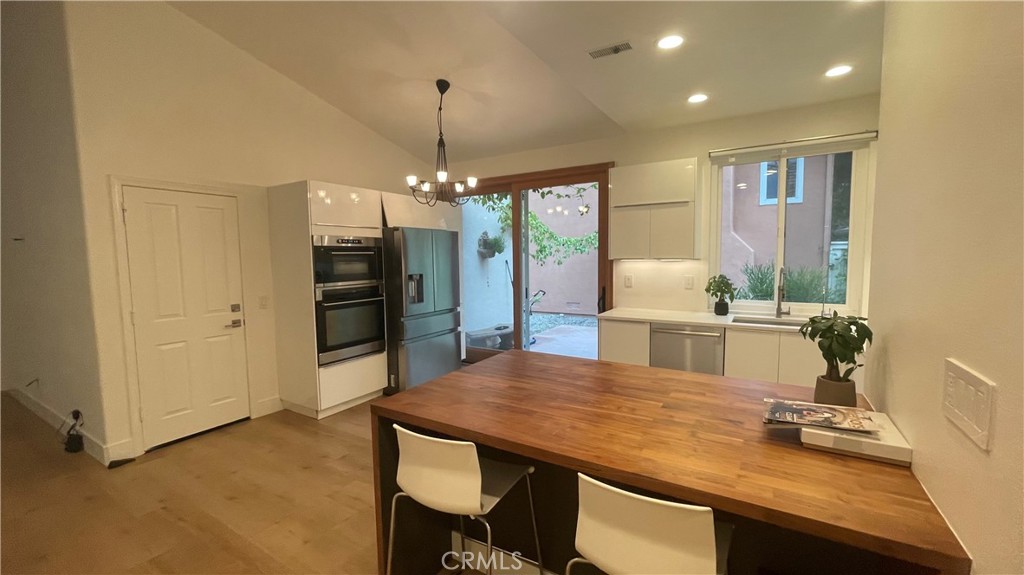 15 Marsala Irvine, CA 92606 - Photo 13 of 31 a view of a dining room with furniture and wooden floor