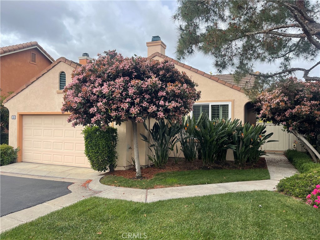 15 Marsala Irvine, CA 92606 - Photo 2 of 31 a front view of a house with a yard and trees