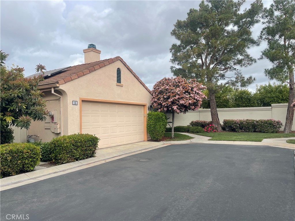 15 Marsala Irvine, CA 92606 - Photo 3 of 31 a front view of a house with a yard and garage