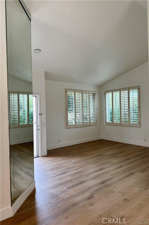 15 Marsala Irvine, CA 92606 - Photo 8 of 31 an empty room with wooden floor and windows