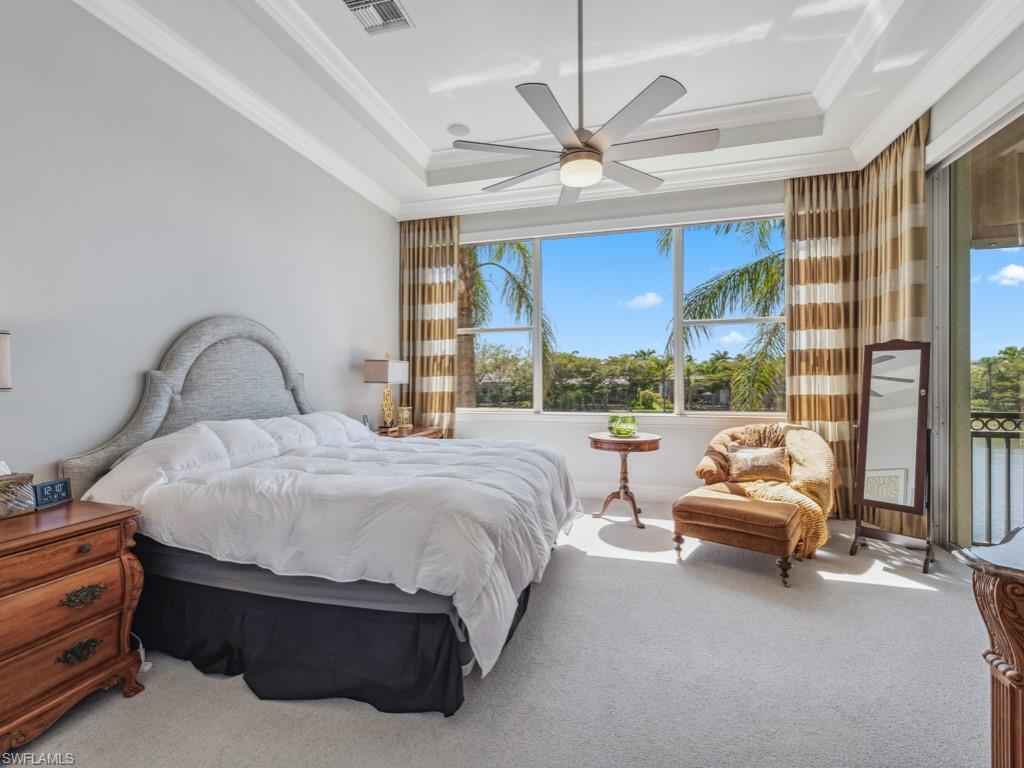 16985 Porta Vecchio Way, Unit 202 Naples, FL 34110 - Photo 17 of 50 a bedroom with a bed and a large window