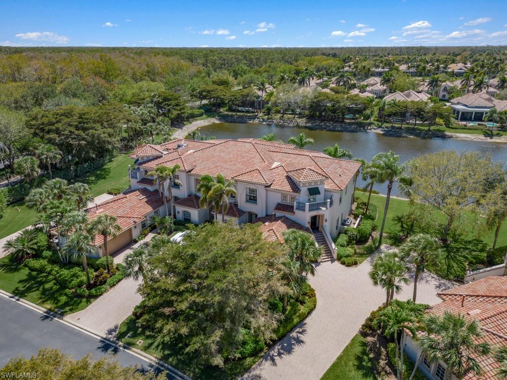 16985 Porta Vecchio Way, Unit 202 Naples, FL 34110 - Photo 25 of 50 an aerial view of a house with a lake view