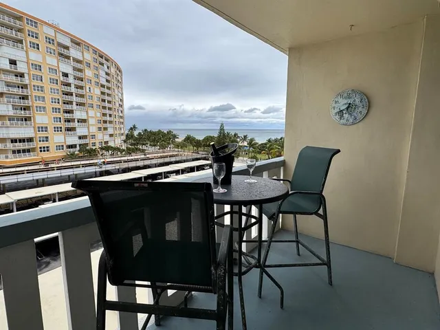 a view of balcony with furniture and city view