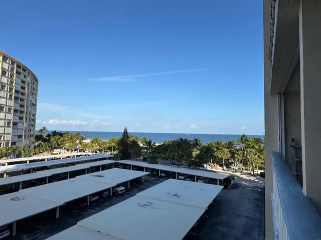 a view of balcony with furniture and city view