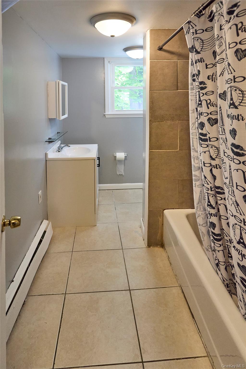 208 North James Street Peekskill, NY 10566 - Photo 8 of 13 Tiled bathroom (Unit 1)