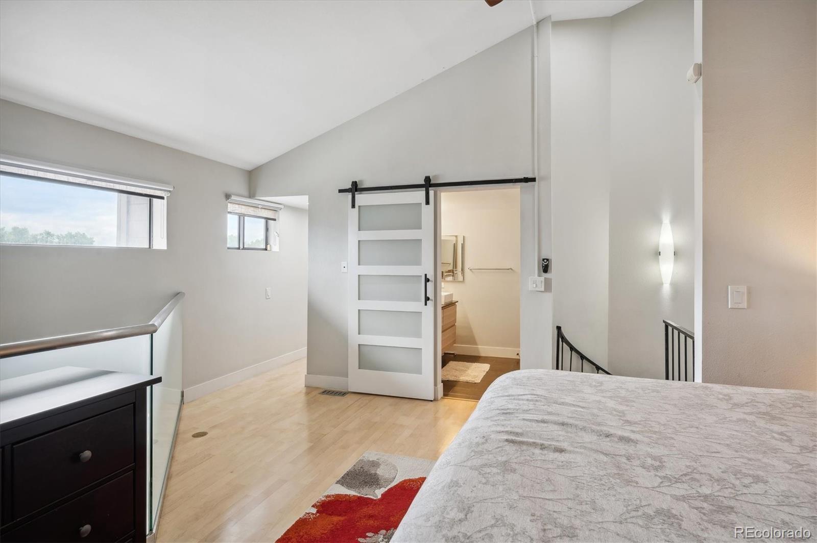350 Detroit Street, Unit 413 Denver, CO 80206 - Photo 14 of 24 a bedroom with a bed and a cabinets