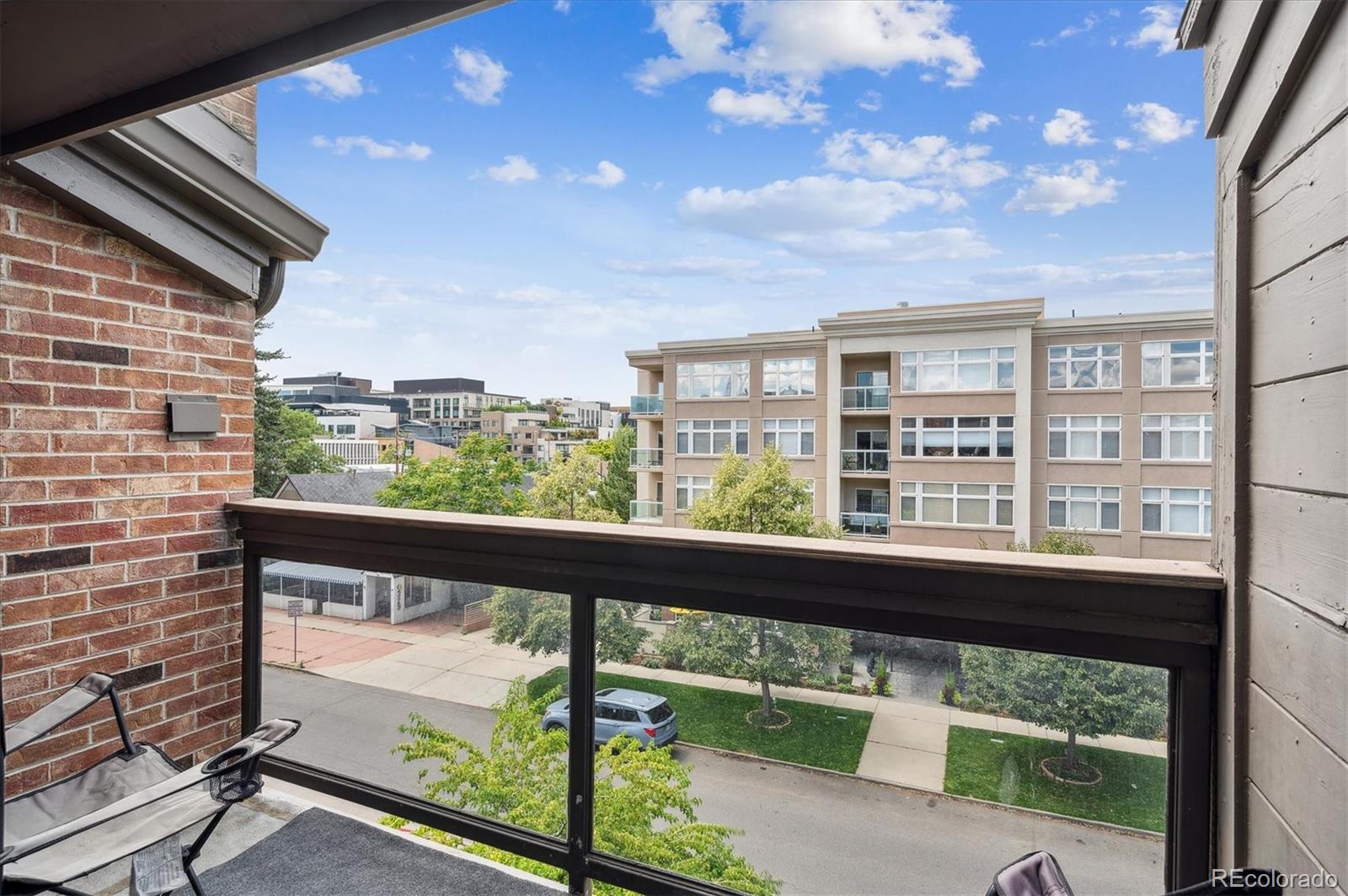 350 Detroit Street, Unit 413 Denver, CO 80206 - Photo 21 of 24 a view of a glass door with sky from balcony
