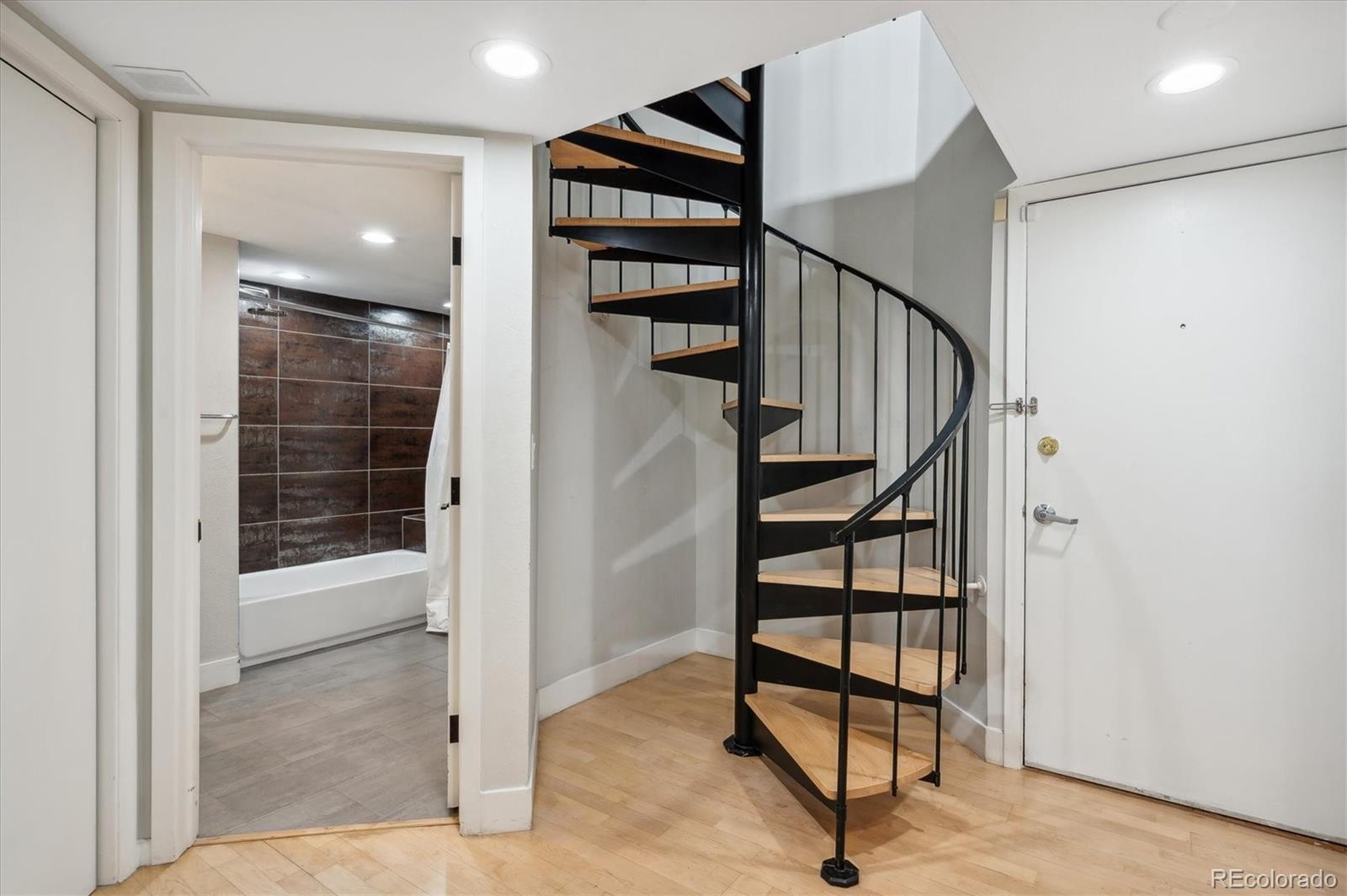 350 Detroit Street, Unit 413 Denver, CO 80206 - Photo 3 of 24 a view of entryway with stairs and a rug