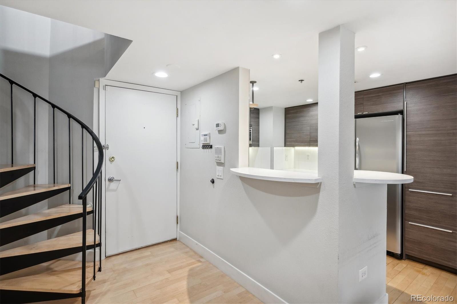 350 Detroit Street, Unit 413 Denver, CO 80206 - Photo 4 of 24 a bathroom with a sink and mirror