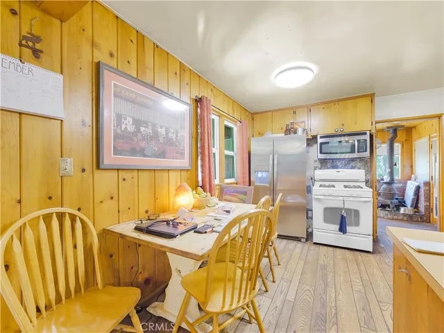 a living room with furniture and large windows