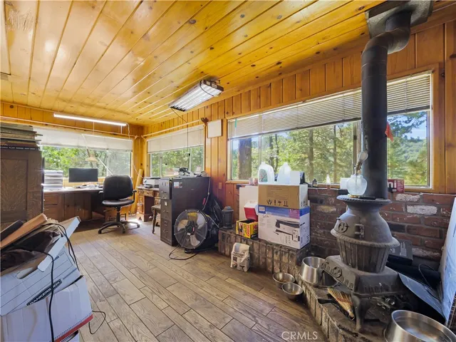 a room filled with wooden floor and furniture