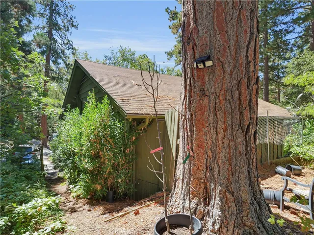 a view of a backyard with sitting area