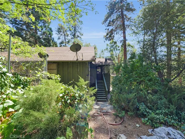 a view of a dirt road with trees