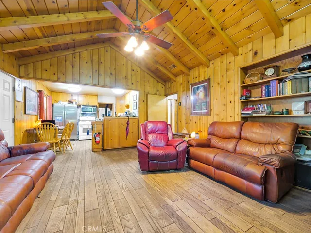 a bedroom with furniture and a book shelf