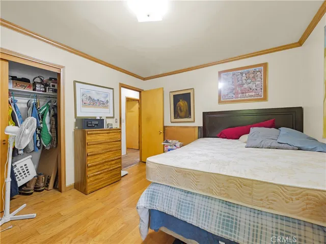 a bedroom with a bed and a view of bedroom