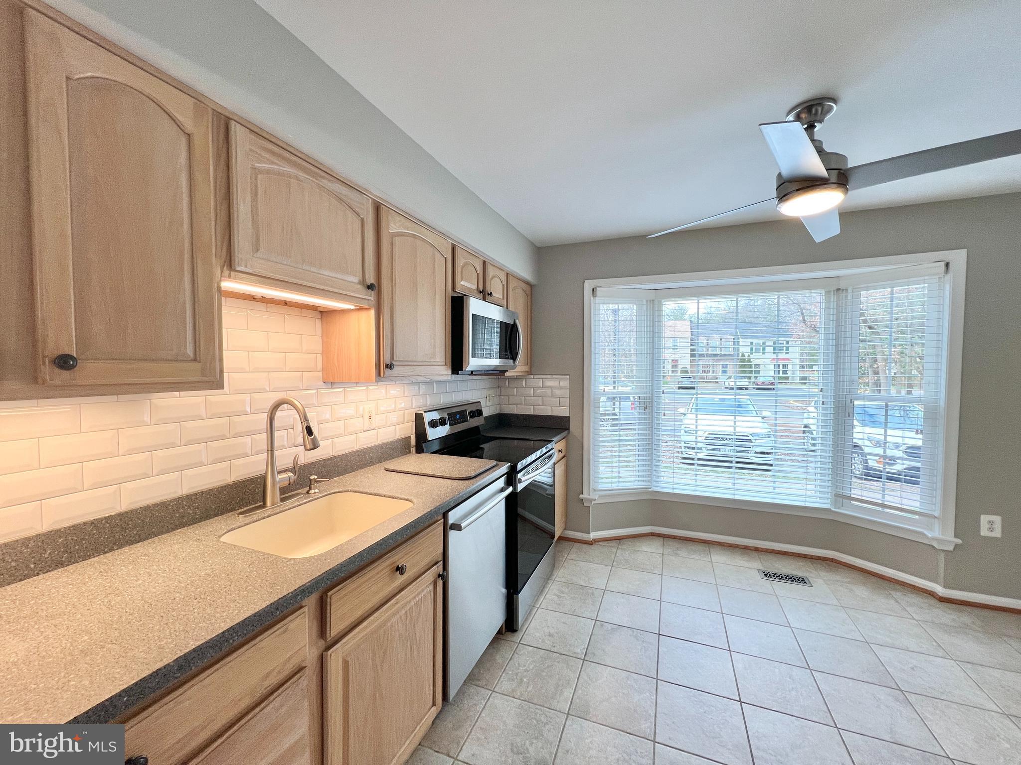 10287 Latney Road Fairfax, VA 22032 - Photo 5 of 26 a kitchen with a sink appliances and cabinets