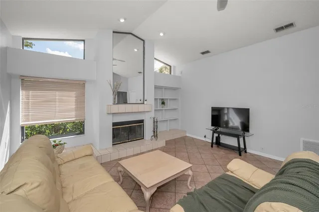 a living room with furniture and a fireplace