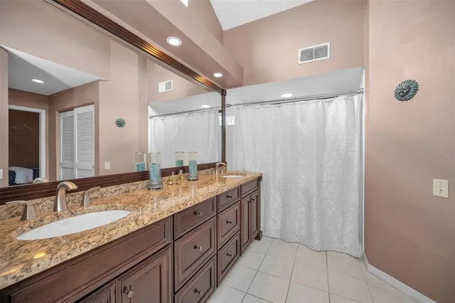 a bed room with a bed and a large window