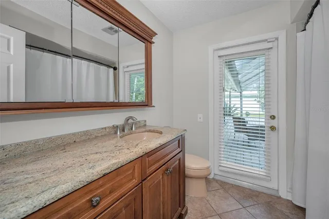 a view of a livingroom with furniture hardwood floor and a window