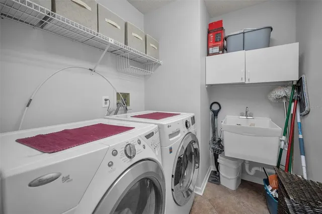 a living room with patio furniture and a floor to ceiling window
