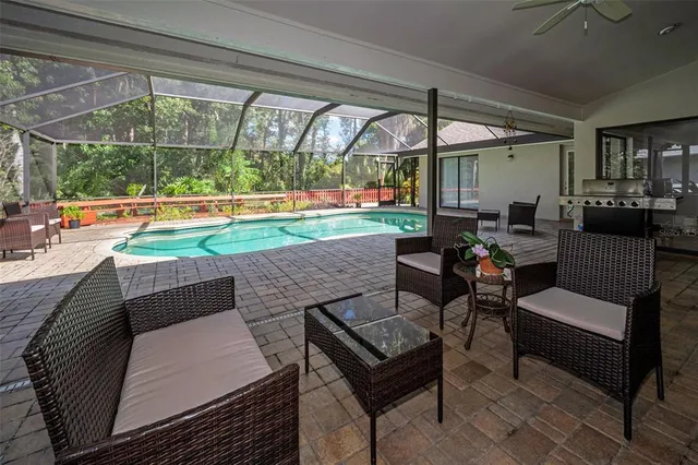 a view of a swimming pool with a patio
