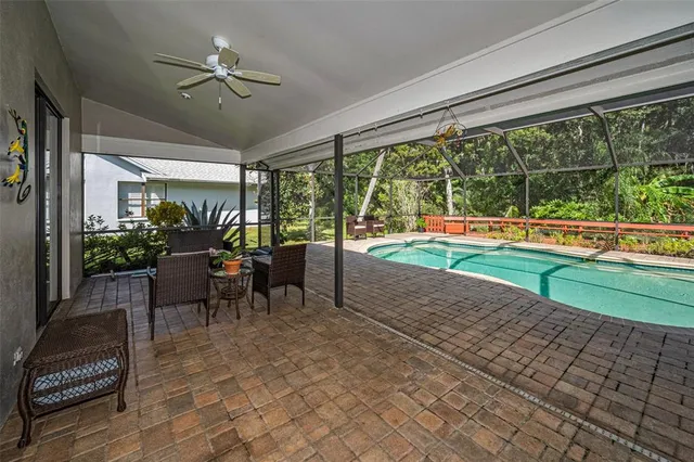 a view of a swimming pool with a patio