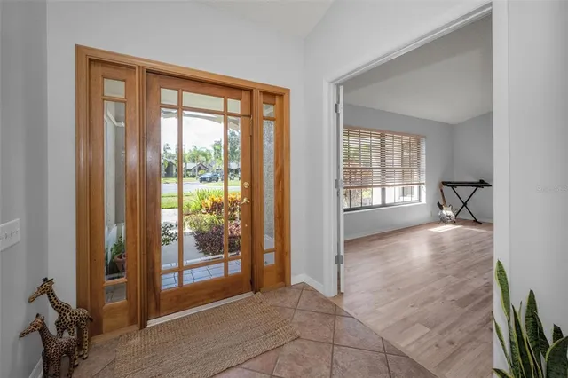 a view of an empty room and a window