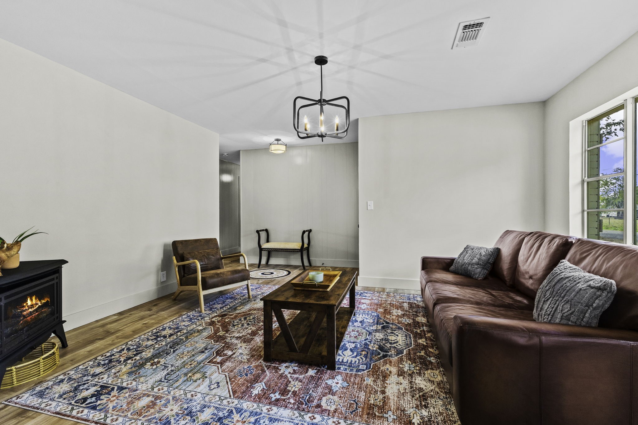 703 Austin Street Columbus, TX 78934 - Photo 14 of 37 a living room with furniture wooden floor and a window