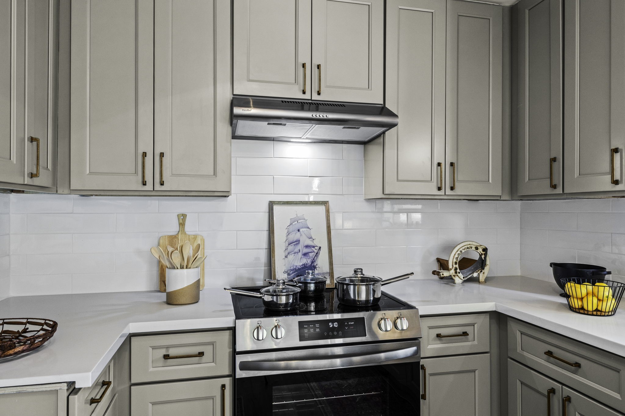 703 Austin Street Columbus, TX 78934 - Photo 24 of 37 a kitchen with a stove and cabinets