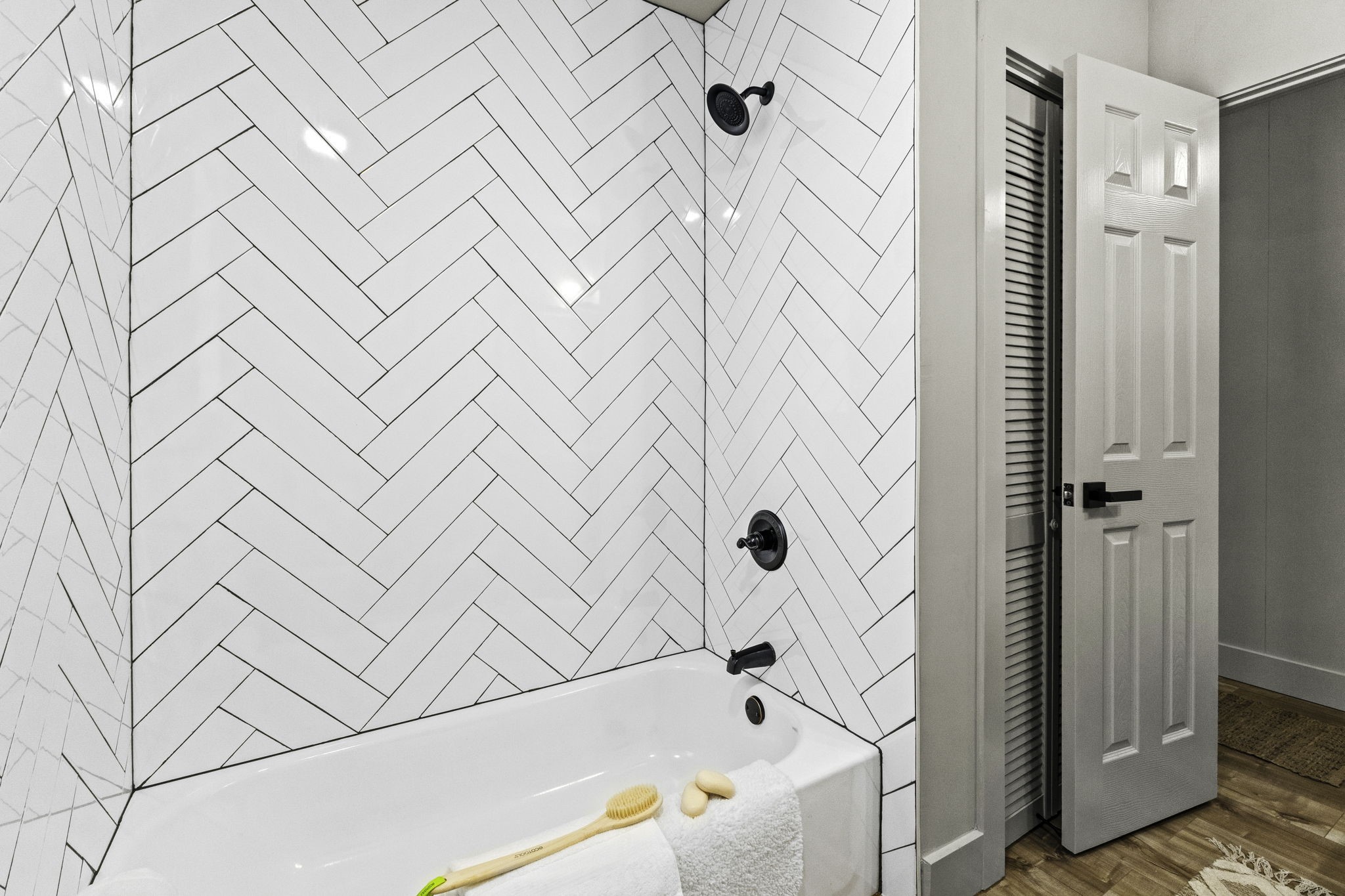 703 Austin Street Columbus, TX 78934 - Photo 28 of 37 a bathroom with a bathtub and shower