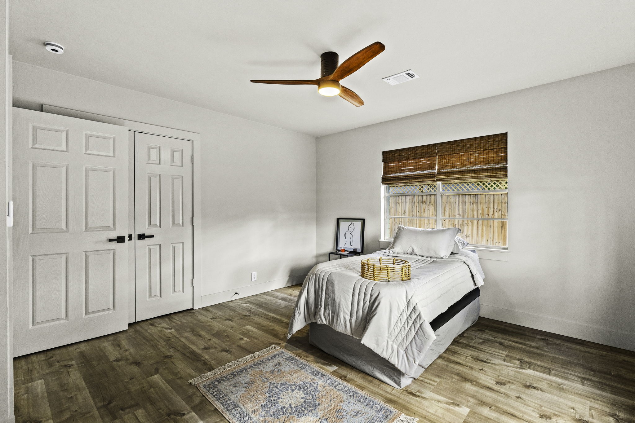 703 Austin Street Columbus, TX 78934 - Photo 30 of 37 a bedroom with a bed and a window