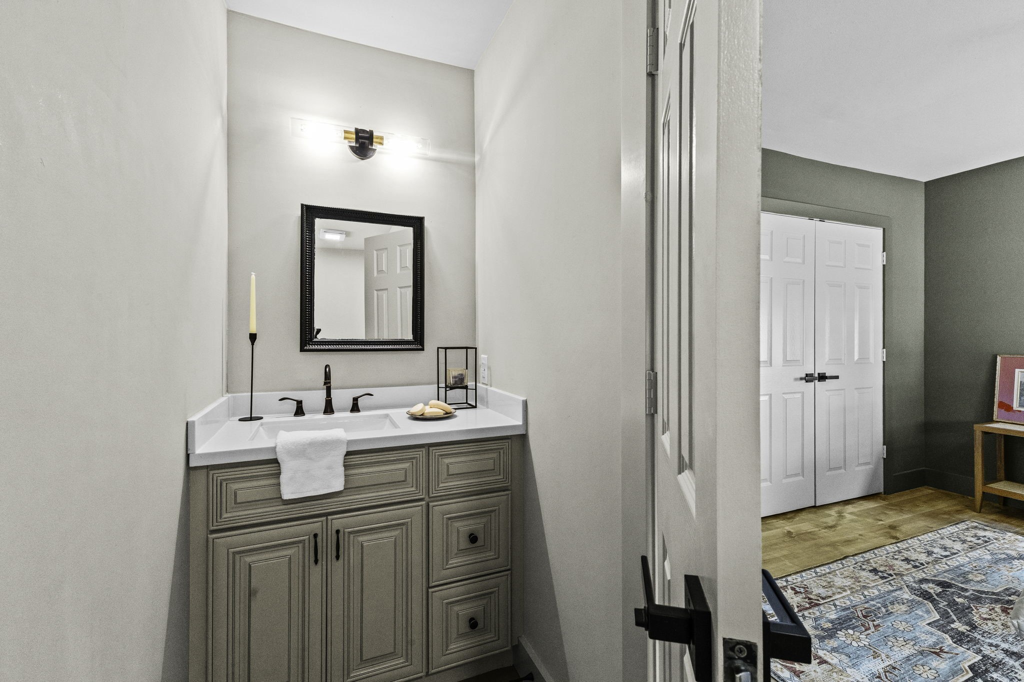 703 Austin Street Columbus, TX 78934 - Photo 34 of 37 a en suite bathroom with a sink and a mirror