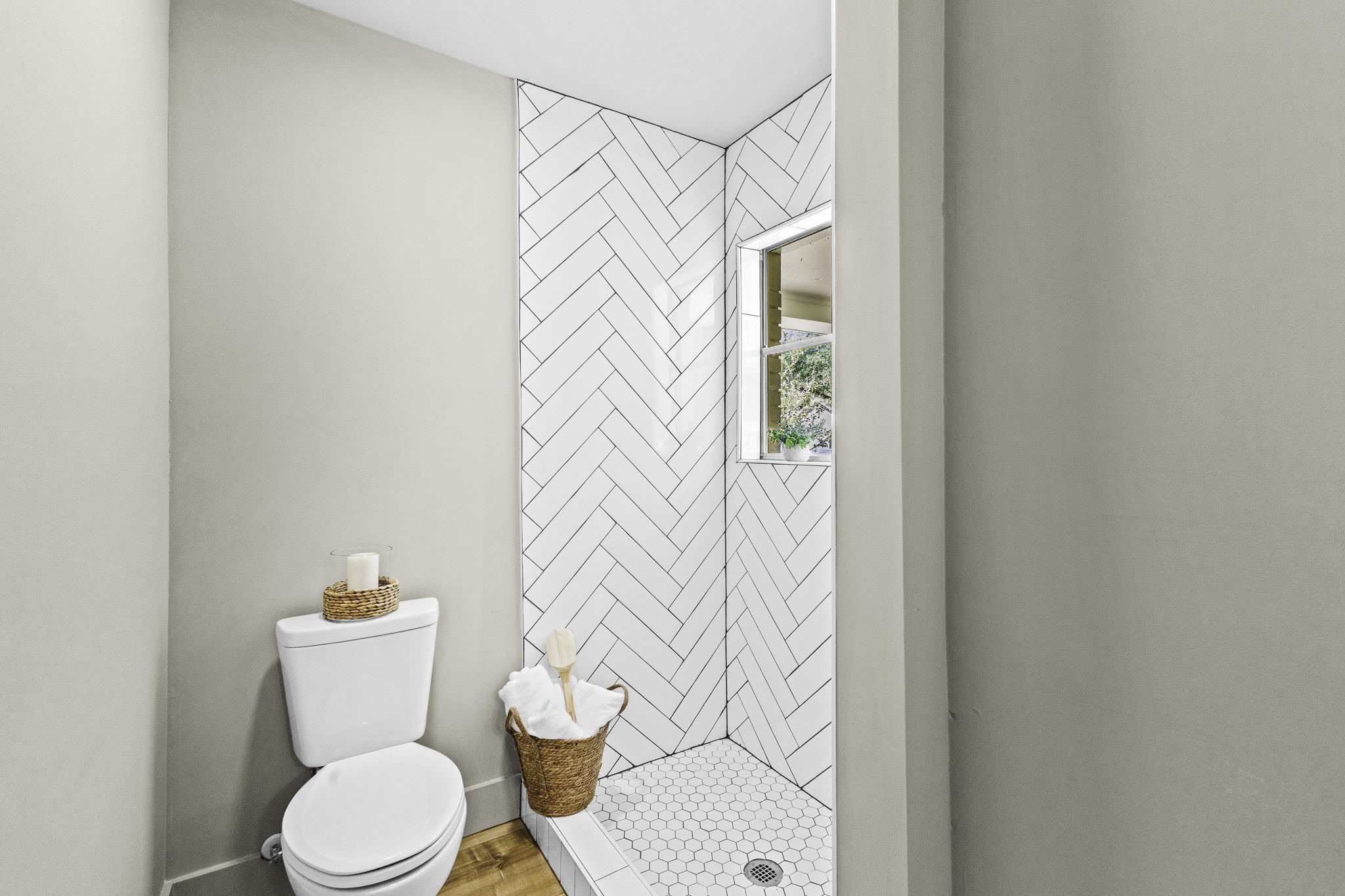 703 Austin Street Columbus, TX 78934 - Photo 35 of 37 a white toilet sitting next to a shower curtain
