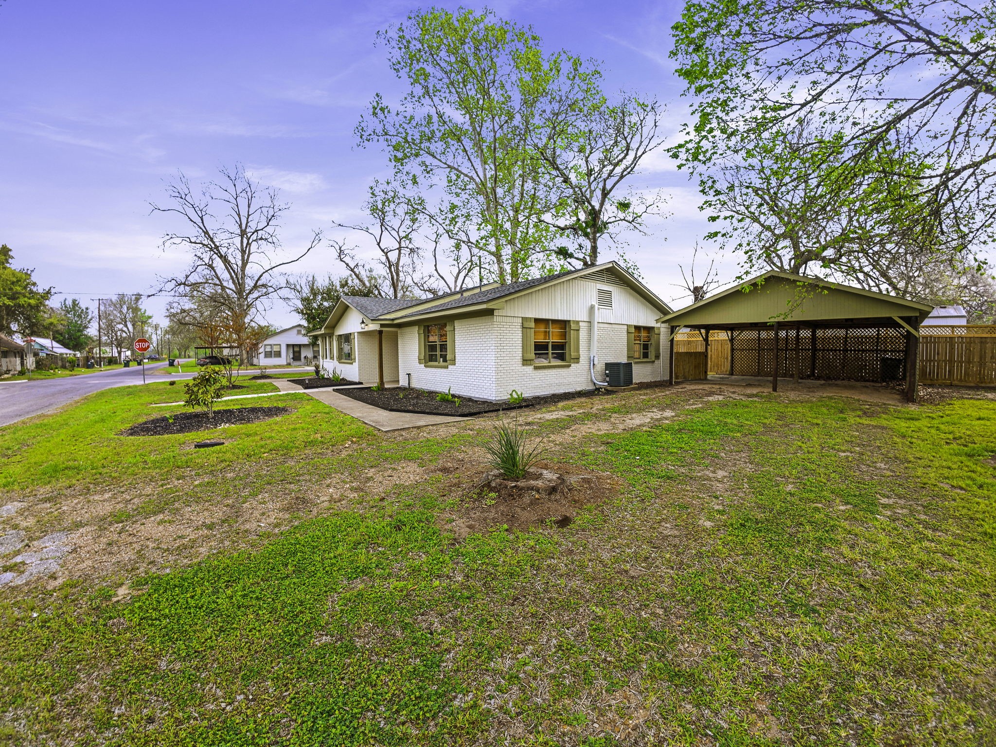 703 Austin Street Columbus, TX 78934 - Photo 5 of 37 a view of a house with a yard
