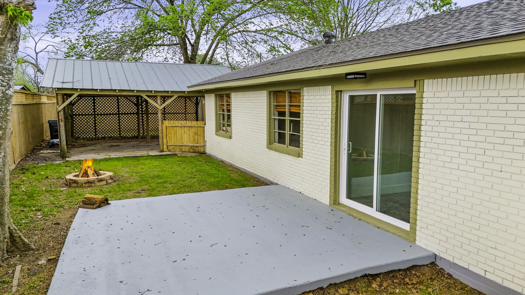 703 Austin Street Columbus, TX 78934 - Photo 7 of 37 a view of a backyard with a small cabin