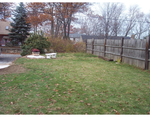86 Indian Run Road Bellingham, MA 02019 - Photo 8 of 12 a view of backyard with wooden fence