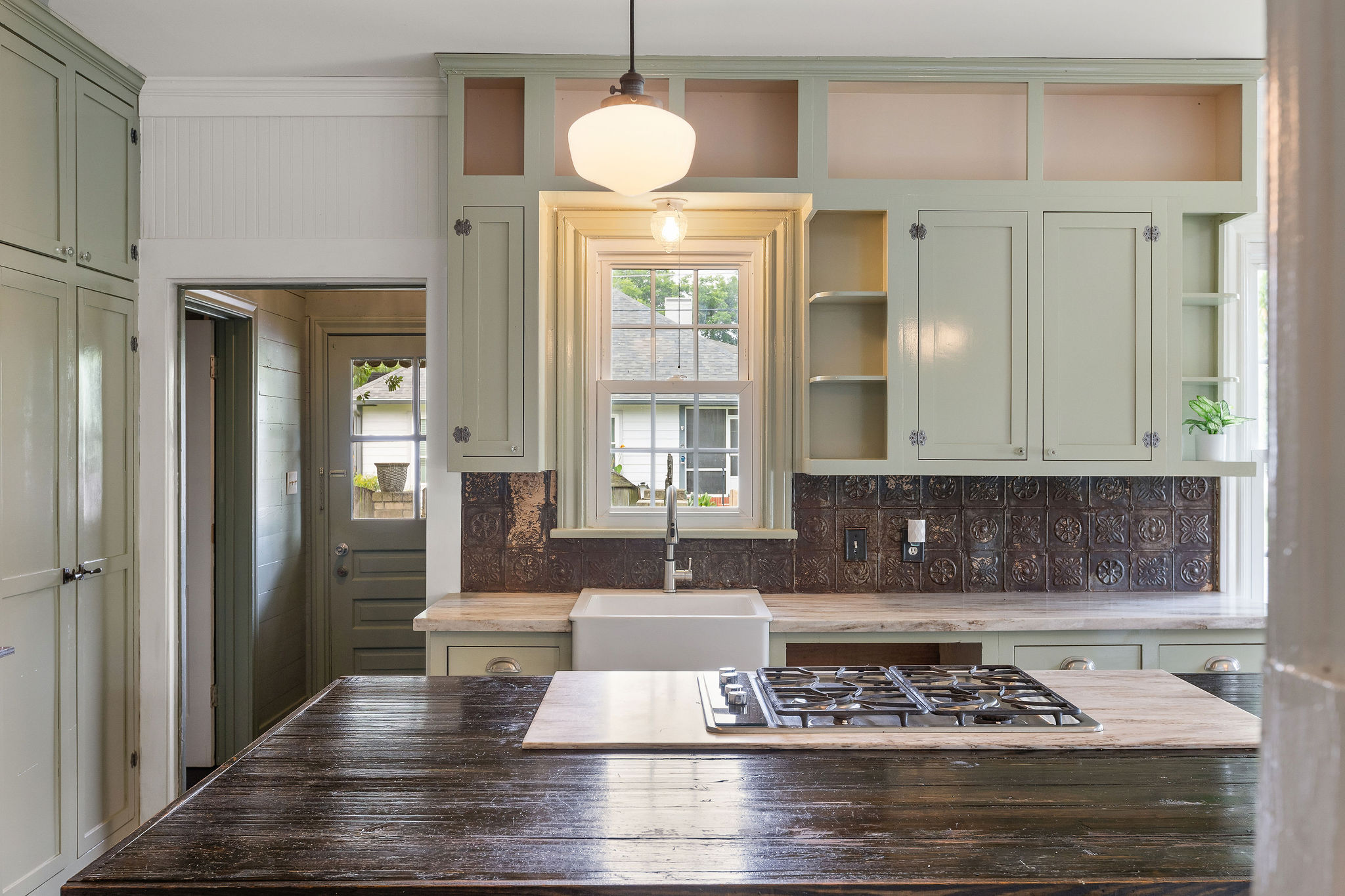 948 Maple Street Lockhart, TX 78644 - Photo 9 of 40 Kitchen features tons of storage, a built-in gas range and a farmhouse sink