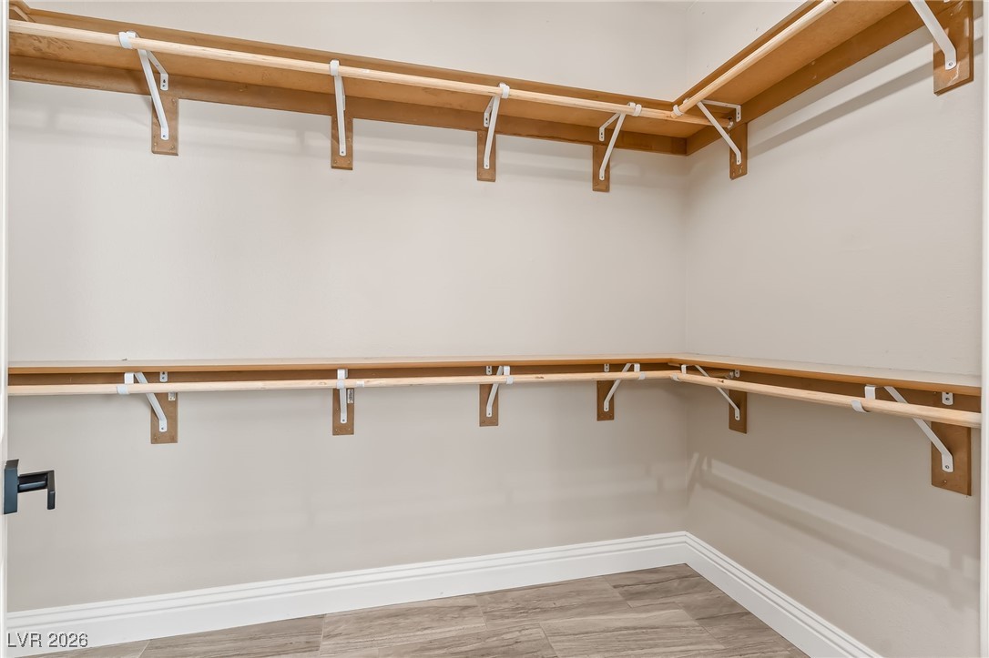 3807 Chapels Royal Street Laughlin, NV 89029 - Photo 27 of 62 Walk in closet in Primary featuring light wood-type flooring