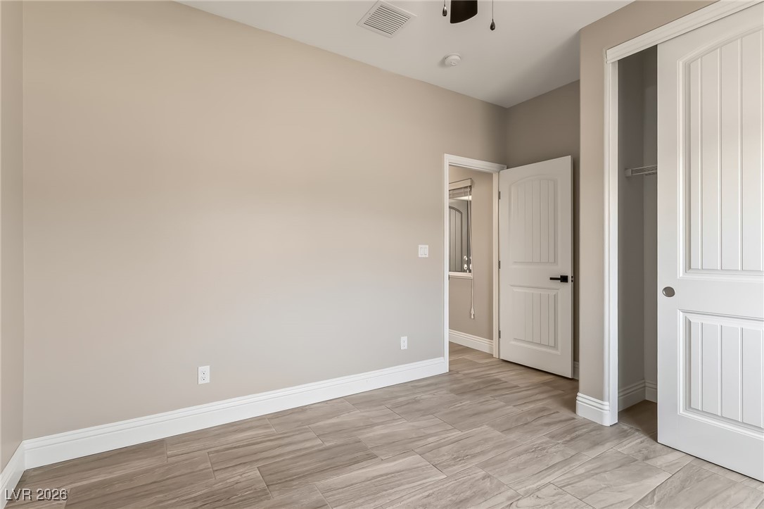3807 Chapels Royal Street Laughlin, NV 89029 - Photo 30 of 62 Second bedroom featuring a closet and a ceiling fan