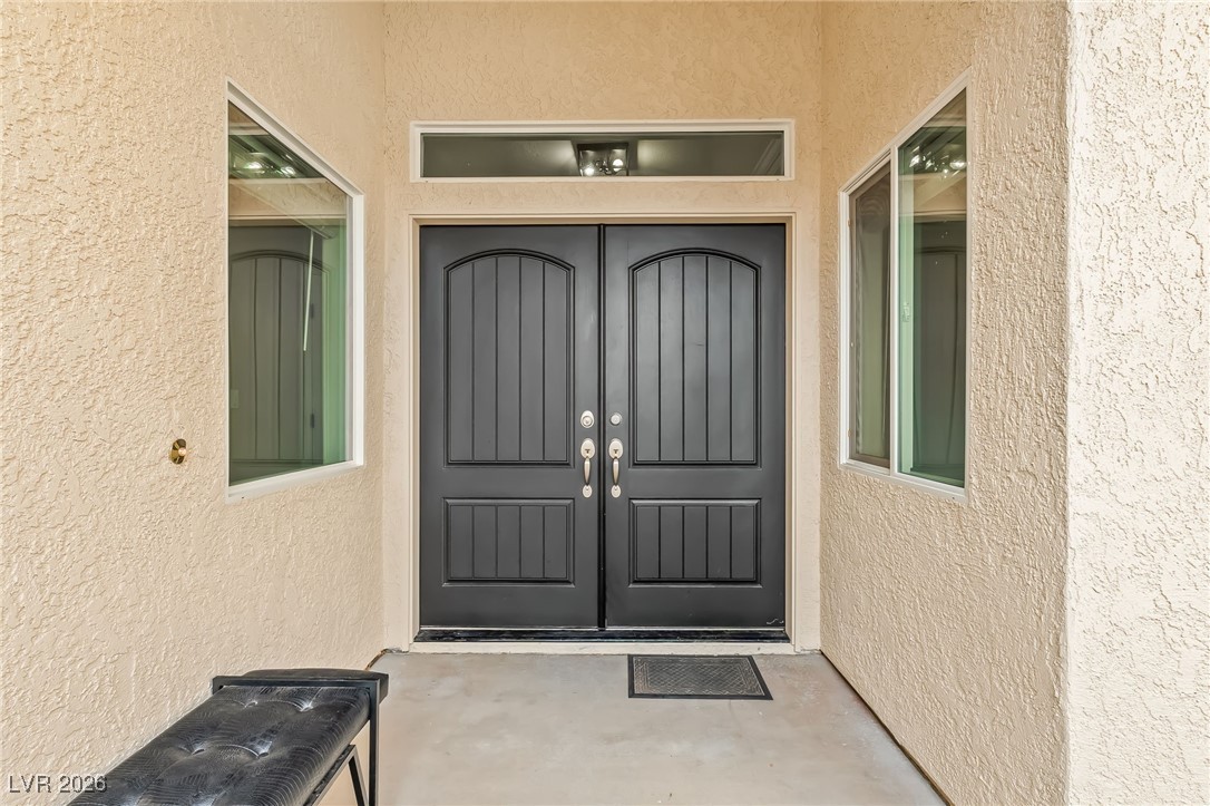 3807 Chapels Royal Street Laughlin, NV 89029 - Photo 3 of 62 Entrance to property with stucco siding