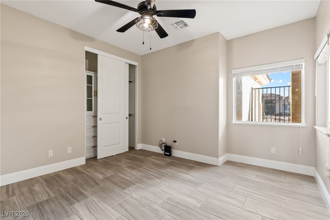 3807 Chapels Royal Street Laughlin, NV 89029 - Photo 32 of 62 Third bedroom featuring wood finish floors and ceiling fan