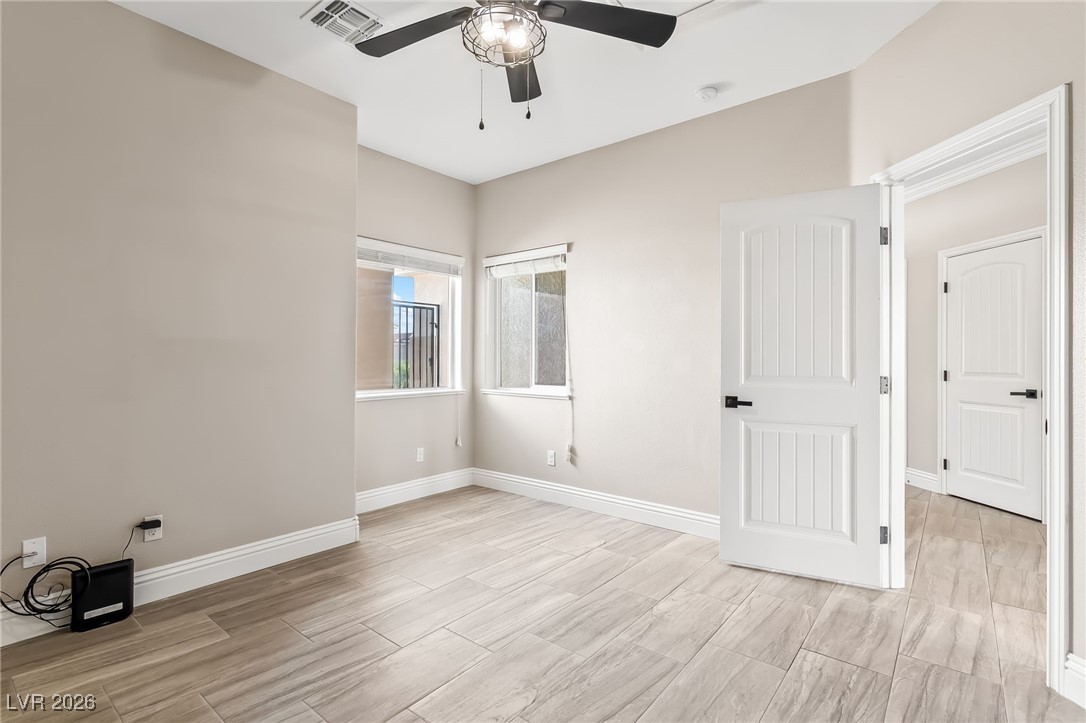 3807 Chapels Royal Street Laughlin, NV 89029 - Photo 34 of 62 Third bedroom featuring a ceiling fan and wood tiled floors