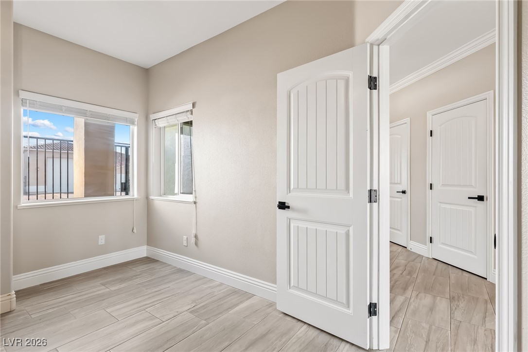 3807 Chapels Royal Street Laughlin, NV 89029 - Photo 35 of 62 Third bedroom with baseboards and wood finish floors