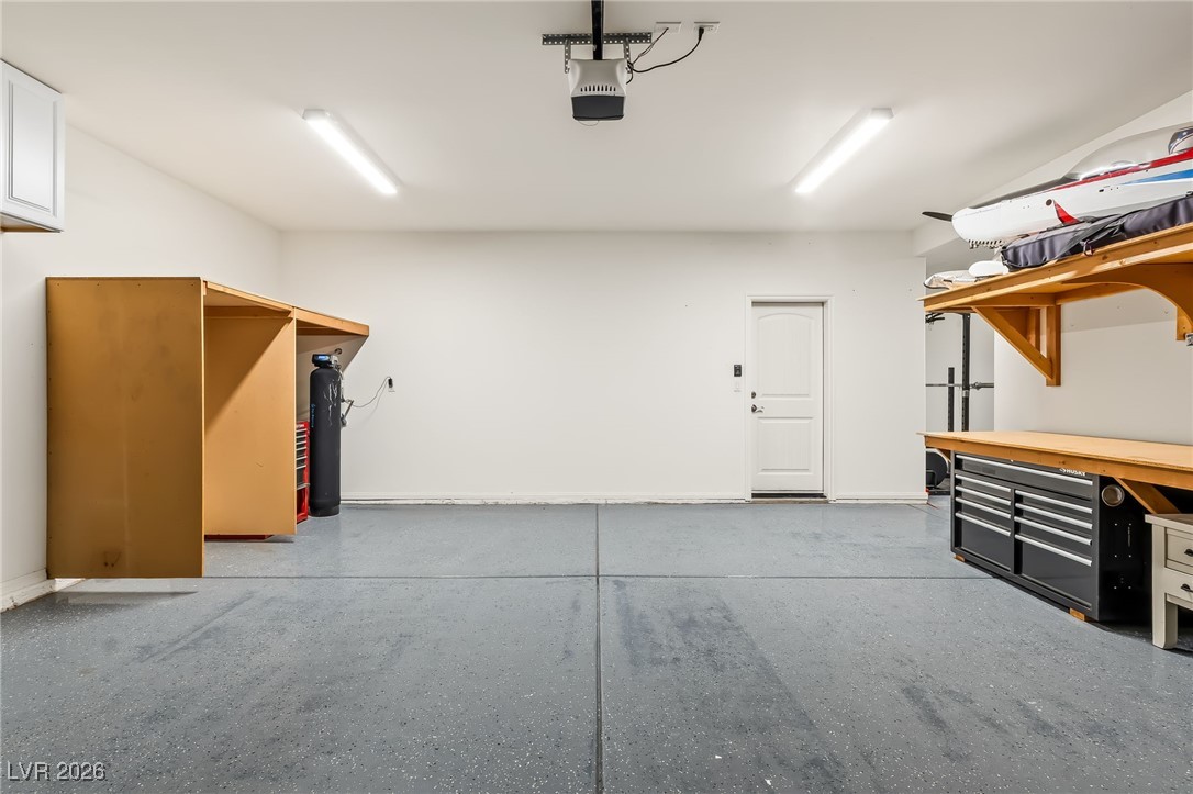 3807 Chapels Royal Street Laughlin, NV 89029 - Photo 39 of 62 Garage with baseboards and a garage door opener